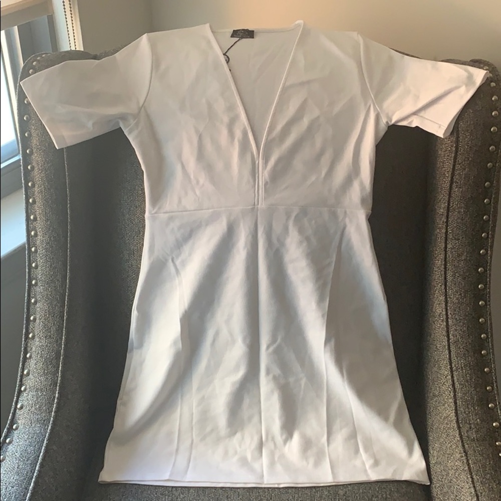 All white dress from Zara size Large . NEVER WORN